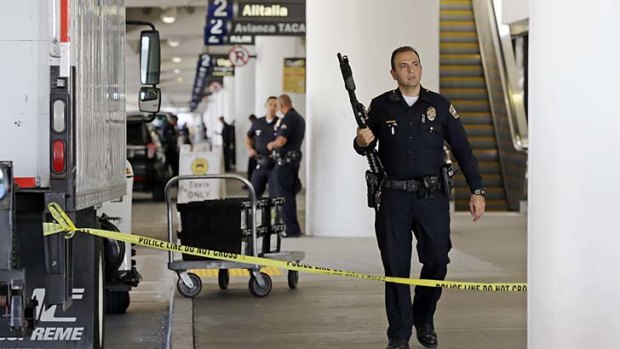 On patrol: Police stand guard at Terminal 2 of LAX.