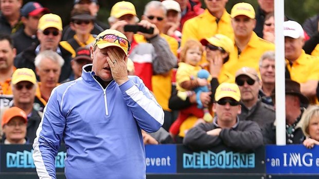 Jarrod Lyle, watched by a huge gallery, is overcome by emotion before his first shot on the first tee.