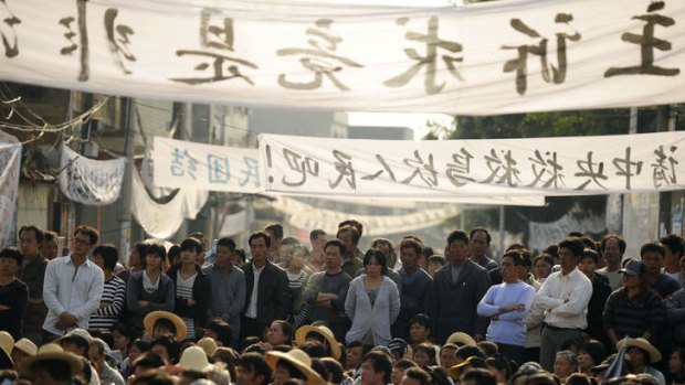 Residents of Wukan rally to demand the government take action over illegal land grabs and the death of a local leader while in police custody.