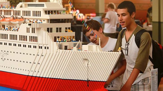 Anthony Lucas (left) and Dimitri Fouras admire the Love Boat, built by Ryan McNaught, at the Lego convention at the Royal Exhibition Building.