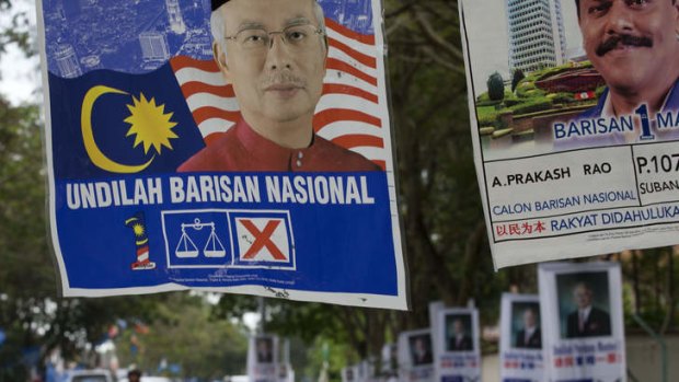 Lining the street: Posters feature Malaysian Prime Minister Najib Razak. Photo: AP
