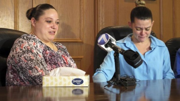 Campaign: Amber McGuire recounts her father's execution as her sister-in-law, Missie McGuire, cries.