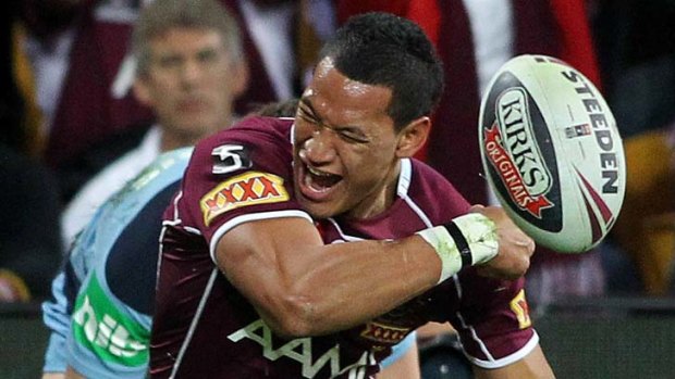In a league of his own ... Folau celebrates scoring a try for the Maroons.