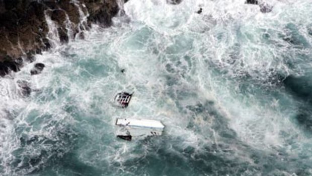 Wreckage of the maxi yacht Shockwave floats in the sea near Port Kembla, NSW.