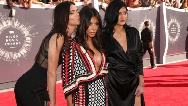 Kim Kardashian and her sisters, Kendall and Kylie Jenner, caused outrage for texting during a minute's silence for Michael Brown and Ferguson.
