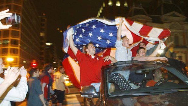 Revelers celebrate the news of the death of Al Qaeda leader Osama bin Laden following a national announcement by U.S. President Barack Obama.