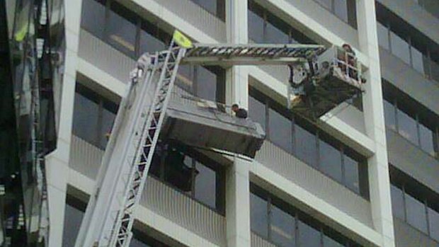 Refusing assistance: the stranded window washers.