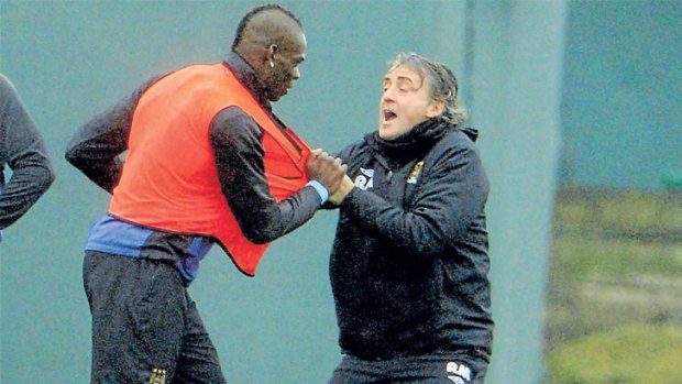 Breaking point: Tempestuous Manchester City striker Mario Balotelli clashes with manager Roberto Mancini.