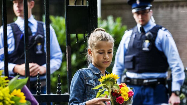 Guards receive flowers in memory of Prince Friso at the gates of Palace Huis ten Bosch, in The Hague, Netherlands.