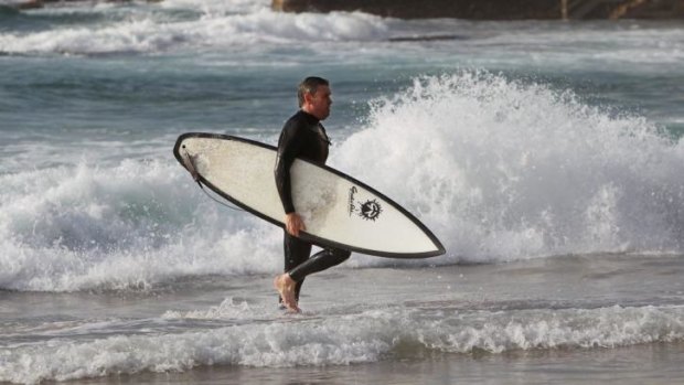 Nine chief executive David Gyngell finishing an early morning surf at Bondi.