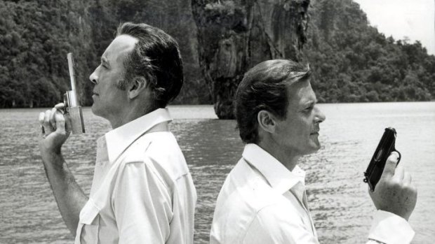 Lee as Scaramanga and Roger Moore as James Bond in <i>The Man with the Golden Gun</i> in 1974.