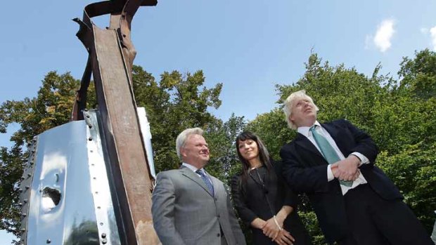 Boris Johnson (R) unveils a sculpture    made from the remains of The World Trade Center.