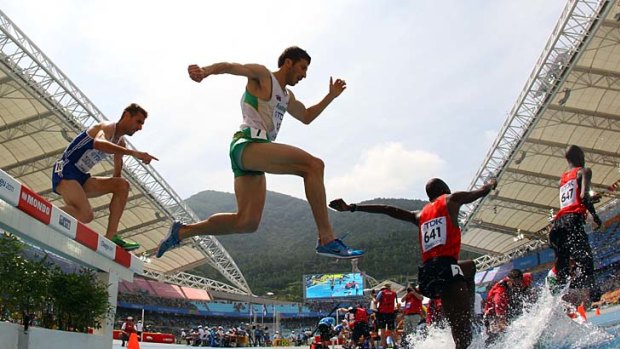 Leap of faith: Youcef Abdi competes for Australia in a heat of the 3000 metres steeplechase at the World Championships in South Korea last year.