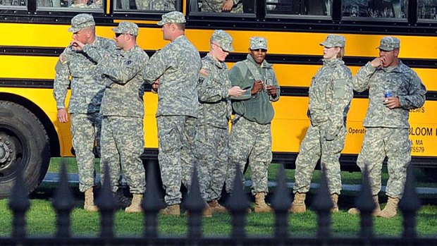 Military personnel seen at the Boston Common staging at the Boston Marathon where several explosions rocked the event.