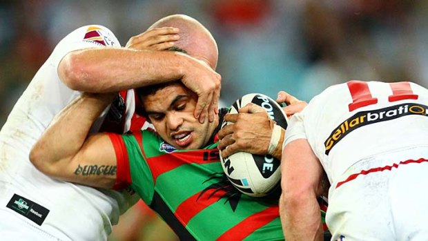 Rabbitoh Greg Inglis confronts the Dragons defence.