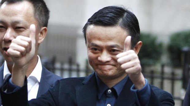 Thumbs up: Alibaba boss Jack Ma poses outside the New York Stock Exchange. But buying into the Chinese e-commerce stock is not without risks.