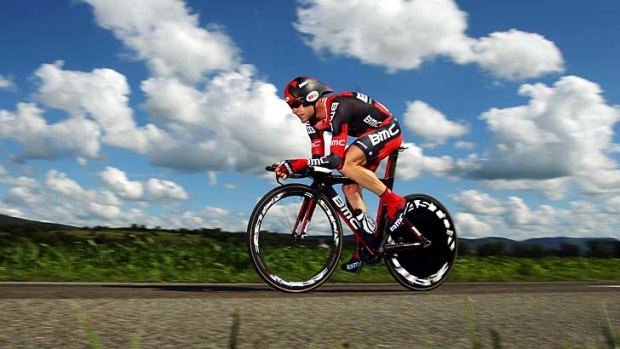 Flat out &#8230; Cadel Evans lost ground in the time trial but will try to reel in leader Bradley Wiggins.