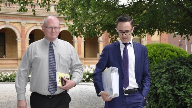 Former Goulburn Mulwaree Council works manager Andrew Palmer leaves Goulburn Courthouse with his legal representative on Wednesday.