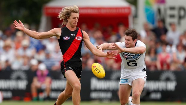 BENDIGO, AUSTRALIA - MARCH 12: Dyson Heppell of the Bombers in action ahead of Patrick Dangerfield of the Cats during the AFL 2017 JLT Community Series match between the Geelong Cats and the Essendon Bombers at the Queen Elizabeth Oval on March 12, 2017 in Bendigo, Australia. (Photo by Adam Trafford/AFL Media/Getty Images)