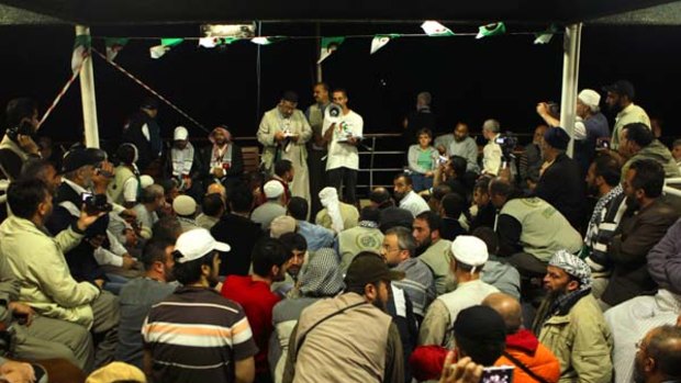 A crowd gathers for a meeting at the stern of the MV Marmara passenger boat, part of the Free Gaza flotilla.