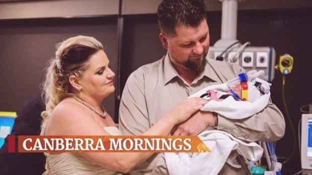 James and Kylie Wiggins of Macarthur with their baby son Dolton at their wedding in the Neonatal Intensive Care Unit at the Canberra Hospital. 