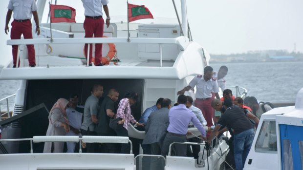Injured people are evacuated after a blast on the Maldives President's boat in Male.