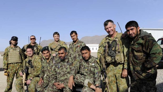 Suspicion ... members of the 6th Battalion of the Afghan National Army with Australian soldiers at the Sorkh Bed compound.