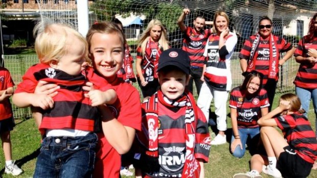 True colours: Western Sydney Wanderers fans get ready for Sunday's grand final.