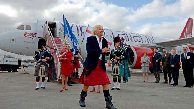Sir Richard Branson arrives in Edinburgh Airport on board the inaugural Virgin Atlantic Little Red flight.