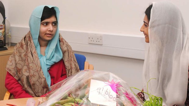 Asifa Bhutto (right), the daughter of Pakistan's president, meets  Malala Yousafzai  at the Queen Elizabeth Hospital in Birmingham in December.