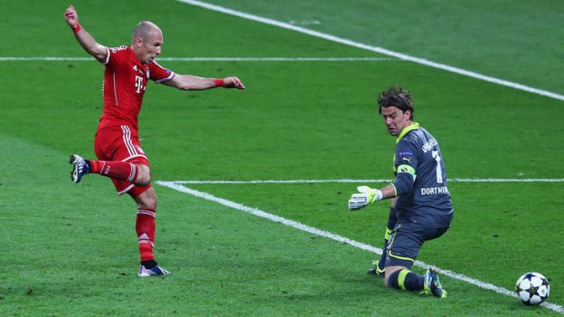 Redemption: Bayern Munich's Arjen Robben scores the winner for the German and European Champions.
