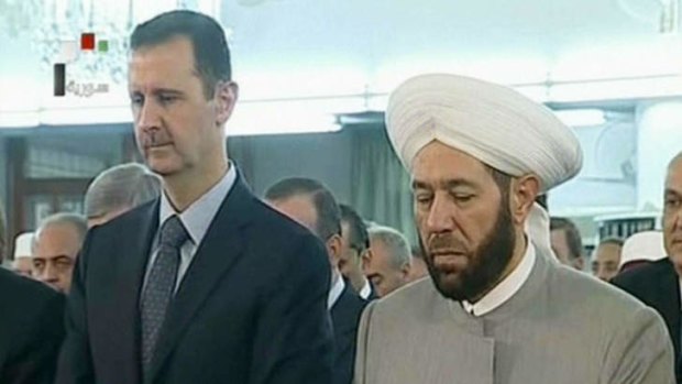 Syrian President Bashar al-Assad and Syrian Grand Mufti Ahmed Hassun attending the morning prayer of Eid al-Fitr in Damascus.