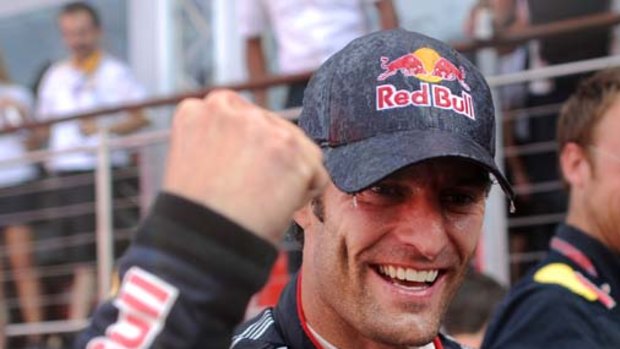 Mark Webber celebrates after winning the British Grand Prix but is convinced his team is favouring teammate Sebastien Vettel of Germany.
