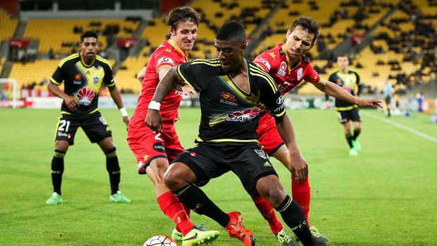 Roly Bonevacia of the Phoenix beats the challenge of Michael Marrone (left) and Isaias of Adelaide United. The A-League must be careful about where it aims to expand.