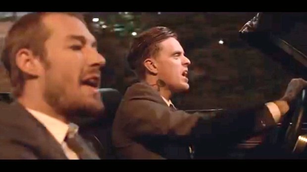 Cowell with Silverchair's Daniel Johns in the music video for <i>Impossible</i>.