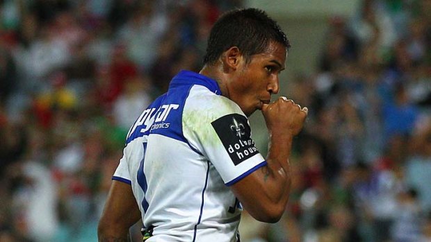 Touching celebration ... Ben Barba sucks his thumb after scoring for the Bulldogs against South Sydney.
