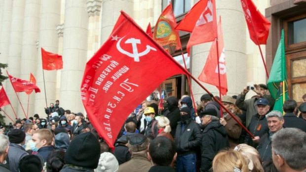 Uprising: Pro-Russian activists wave communist flags during a rally in the eastern Ukrainian city of Kharkiv. 