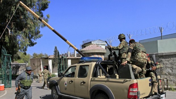Afghan National Army soldiers (ANA) arrive at the compound of a provincial governor's office in Jalalabad.