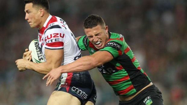 Star burst: Sam Burgess tries to come to grips with a rampaging Sonny Bill Williams last year.