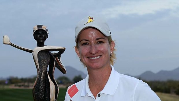 Karrie Webb poses with the championship trophy after the final round of the RR Donnelley LPGA Founders Cup.
