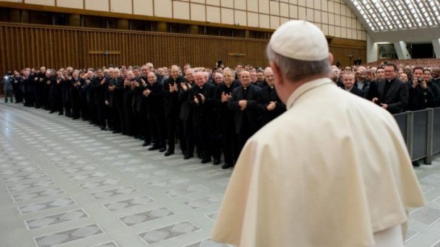 Pope Francis arrives for a meeting with Roman priests at the Vatican on Thursday. He has named top financial laymen to a new Vatican Council for the Economy. 