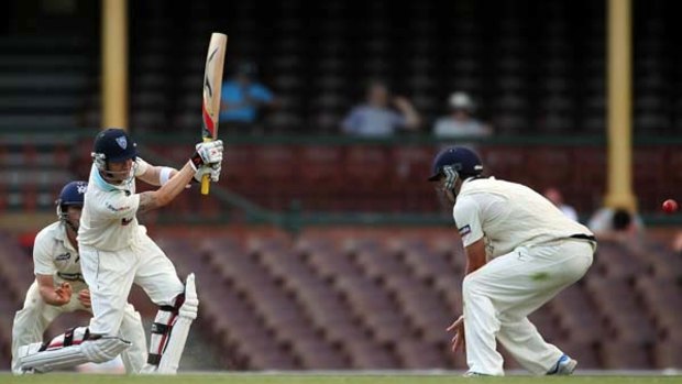 Michael Clarke hits out during the drawn Sheffield Shield match between Victoria and  NSW at the SCG yesterday. Clarke was unbeaten on 39 at the close of play but under an injury cloud.