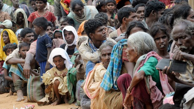 Human cost ... people take shelter in a northern village after fleeing an area still controlled by the Tamil Tigers.