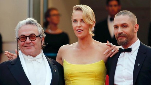 Director George Miller (from left) with  Charlize Theron and Tom Hardy on  the red carpet as they arrive for the screening of  Mad Max: Fury Road at the  Cannes Film Festival.
