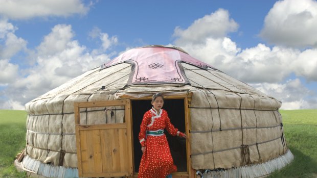 Best 'roughing it' experience: Mongolian Girl stepping out of her Yurt in Inner Mongolia.
