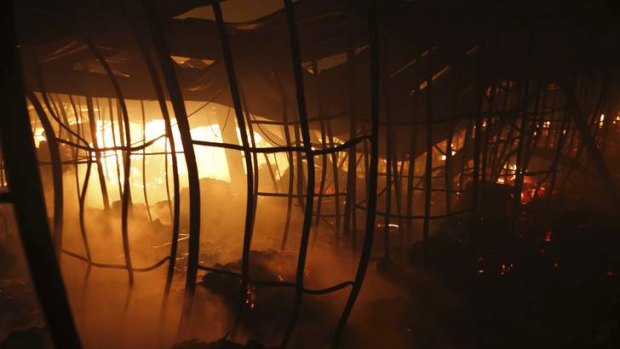Fire burns inside the factory.
