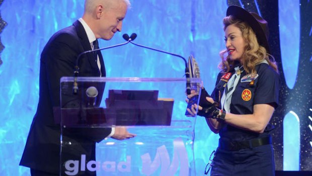 Scouts honour... Madonna presents Anderson Cooper with a GLAAD Media Award.