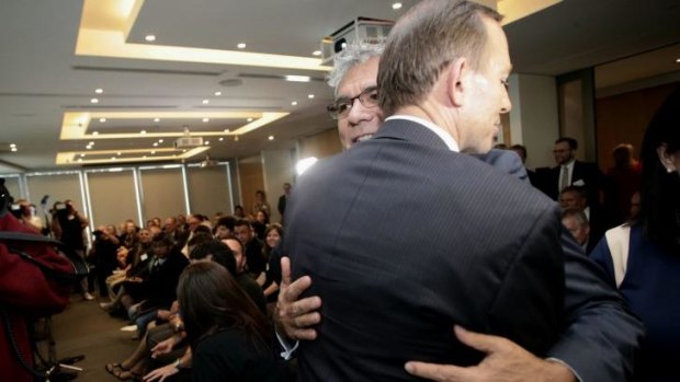 "Defining moment": Tony Abbott embraces Warren Mundine during the Empowered Communities launch in Sydney on Wednesday.