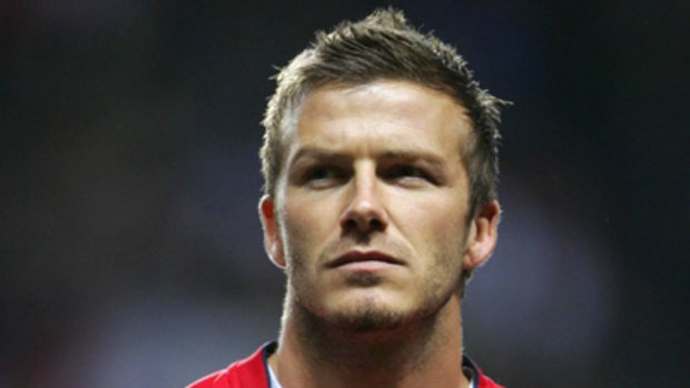 David Beckham's management will take legal action against a magazine which claimed the football star used prostitutes.