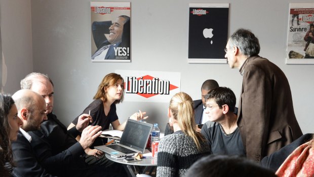 Editorial staff of French satirical newspaper <i>Charlie Hebdo</i> and <i>Liberation</i> gather. 